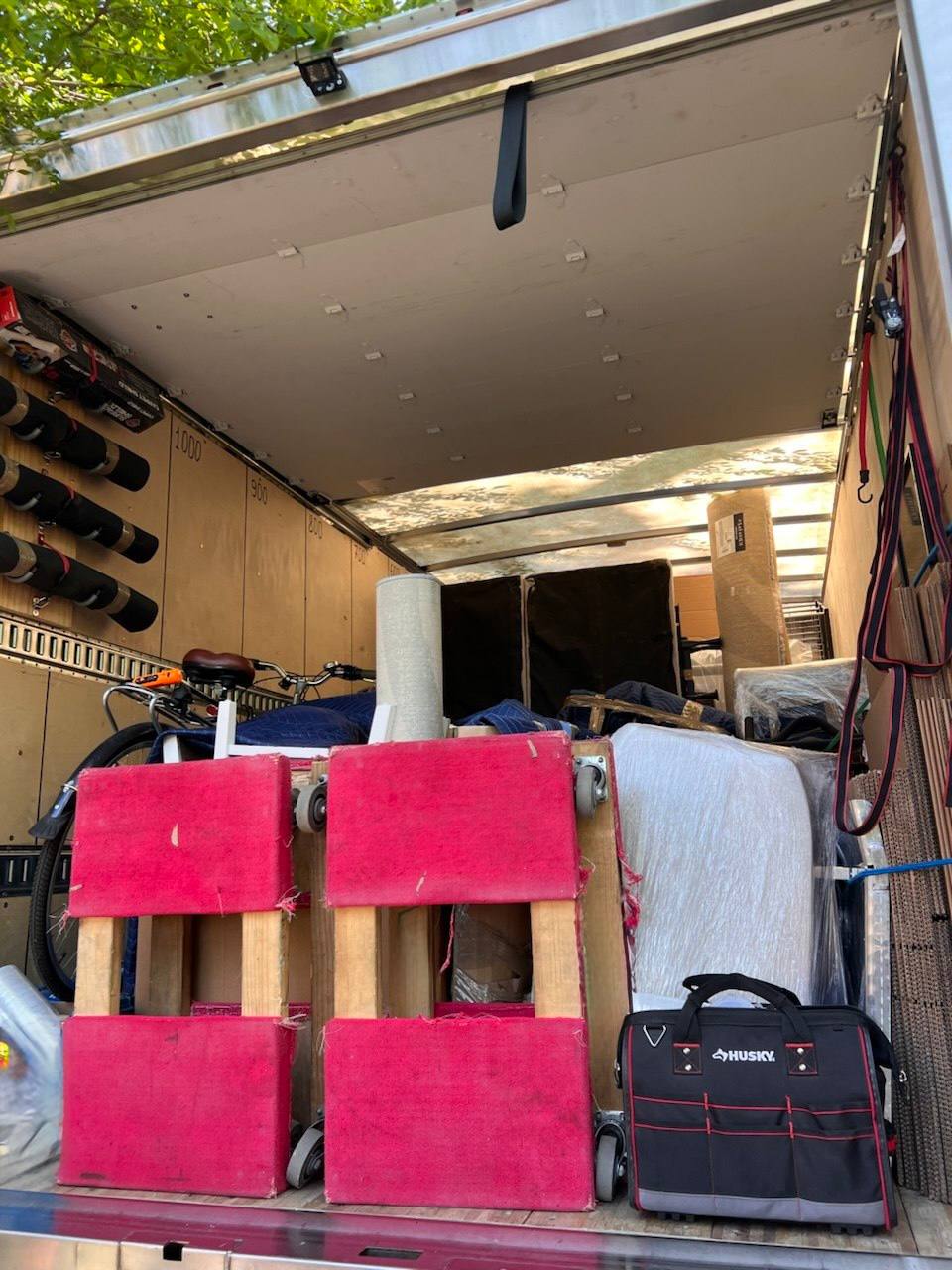 Moving truck fully loaded with boxes and furniture