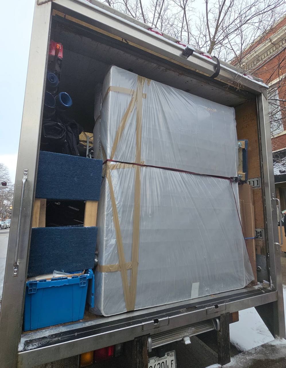 Chicago apartment furniture moving through narrow hallway